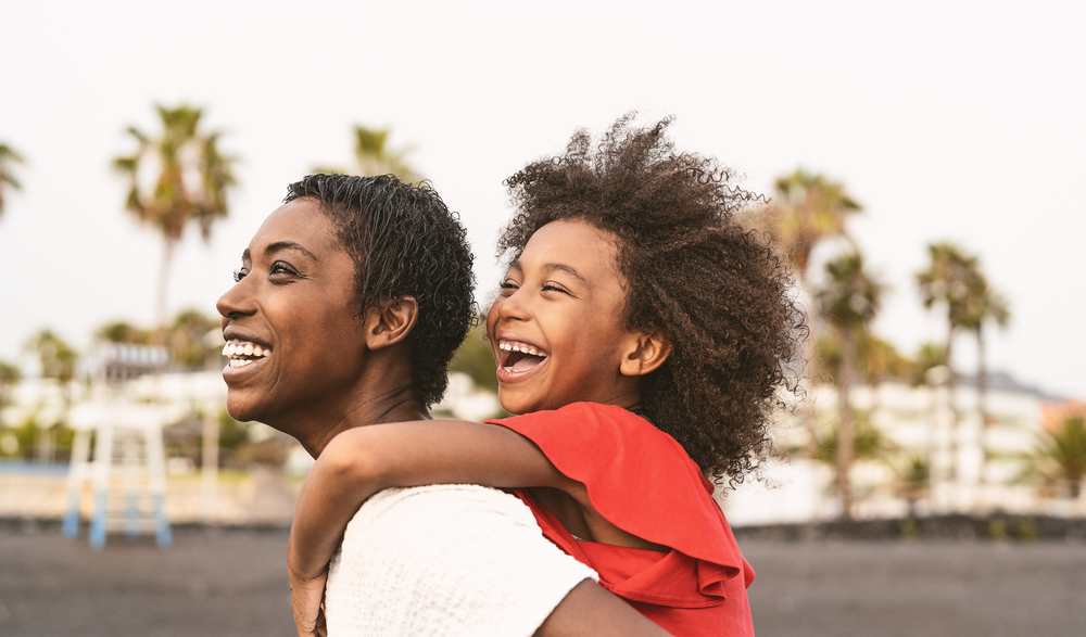 mom and daughter at a california beach