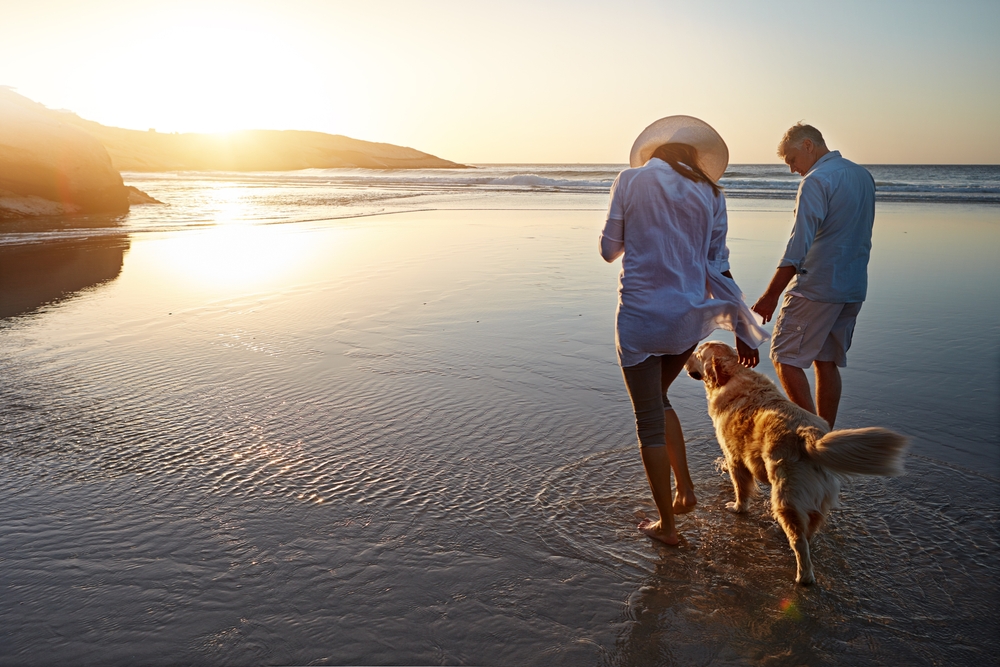couple walking on a beach in california