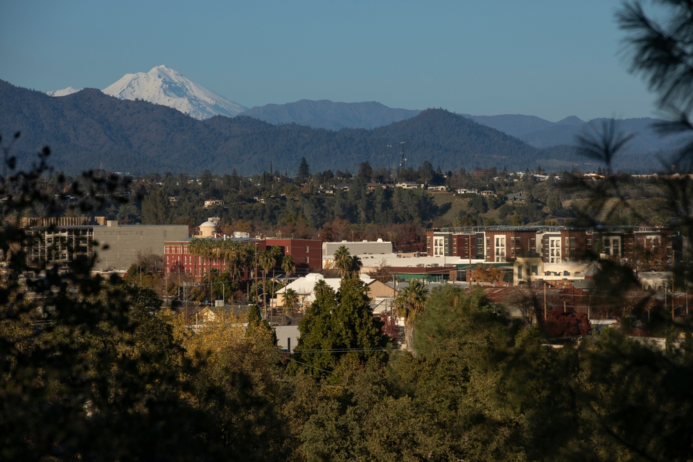 view of the peak of Mount Shasta and the downtown skyline of Redding, California