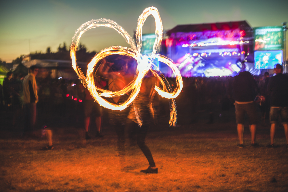 Fire dancer at a music festival