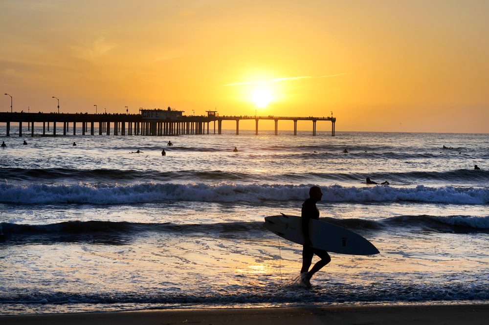 surfer and pier san diego